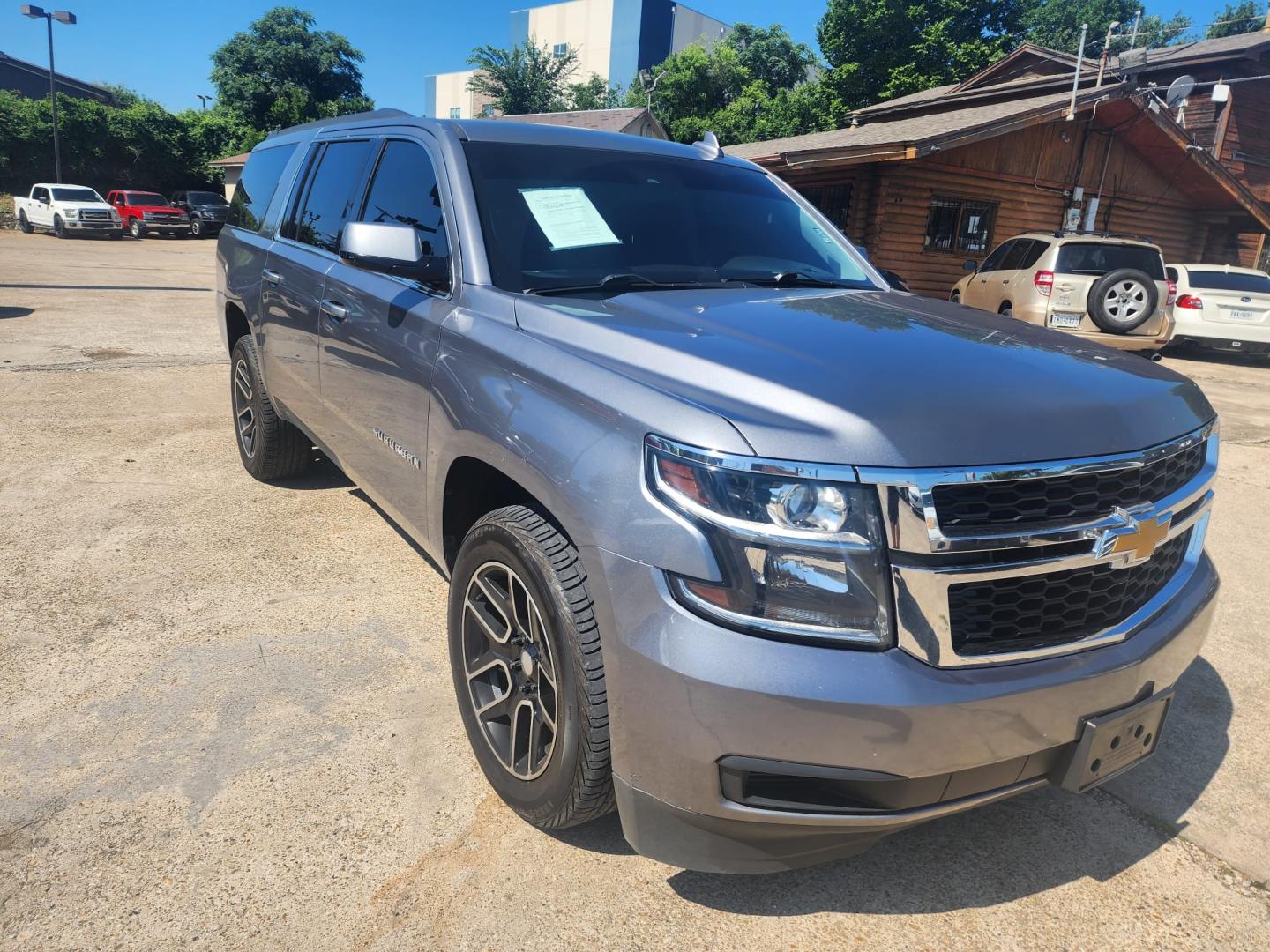 2019 Gray /Black Chevrolet Suburban (1GNSKHKC1KR) , located at 945 E. Jefferson Blvd, Dallas, TX, 75203, (214) 943-7777, 32.752514, -96.811630 - Photo#2